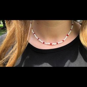 Red and White necklace.